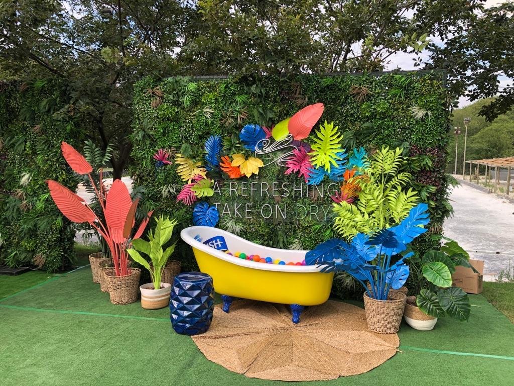 Isilumko-Activate Street-level marketing teams are hosting a tropical themed party featuring a bathtub filled with colorful plants.