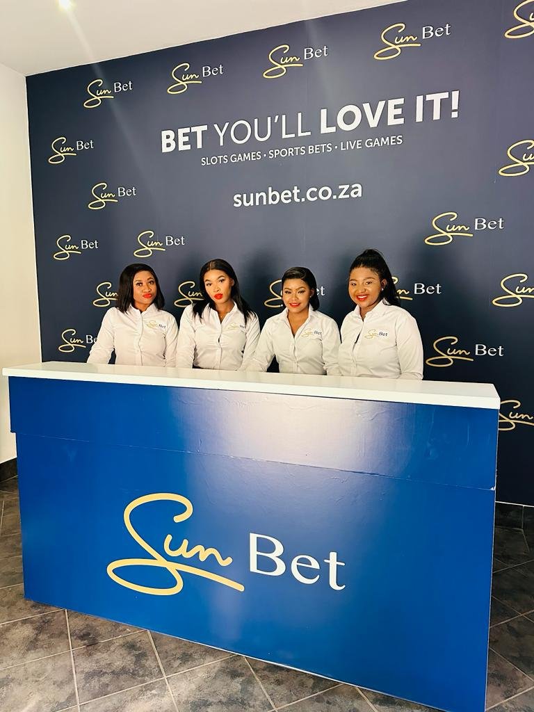Isilumko-Activate Street-level marketing teams standing in front of a sunset sign.