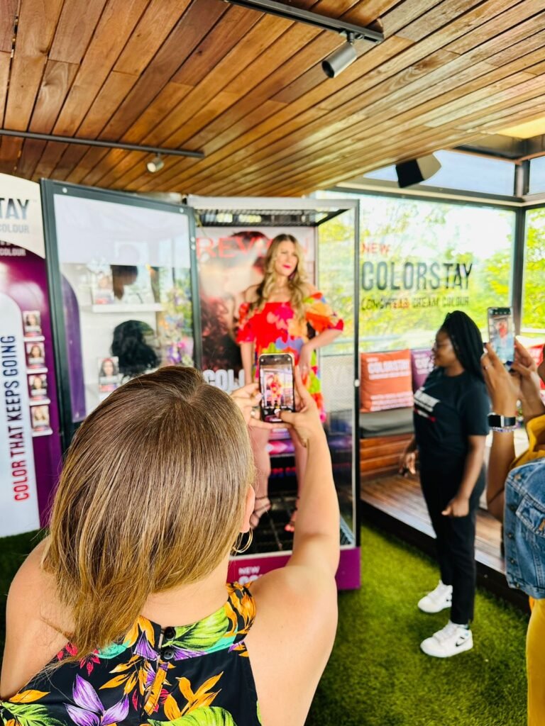 Isilumko-Activate A group of people capturing images of a mannequin, showcasing the expertise of top digital marketing agencies.