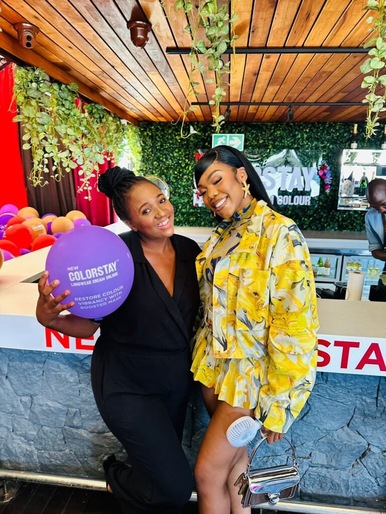 Isilumko-Activate Two women posing for a photo at a event organized by one of the best digital marketing agencies.