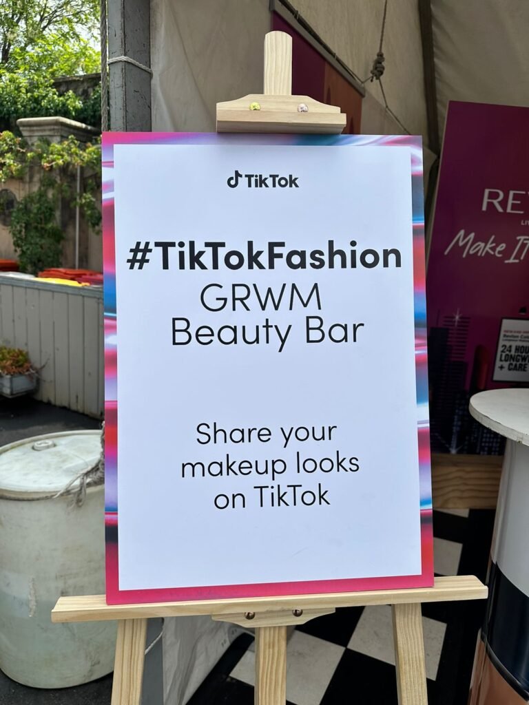 Isilumko-Activate A sign that says tik tok fashion gloom beauty bar.