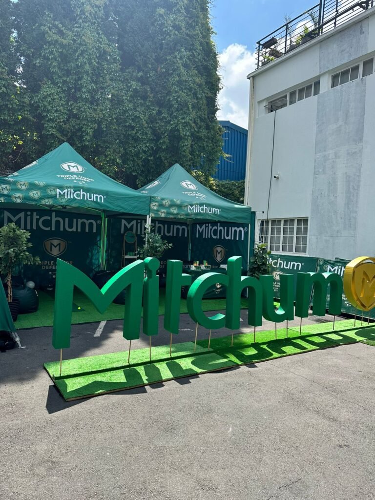 Isilumko-Activate A green tent with a promotional sign that says milchum.