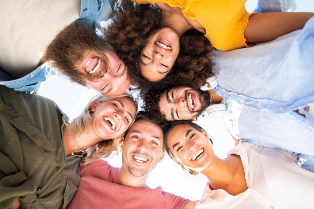 Isilumko-Activate A group of people from a promoter agency standing in a circle and smiling.